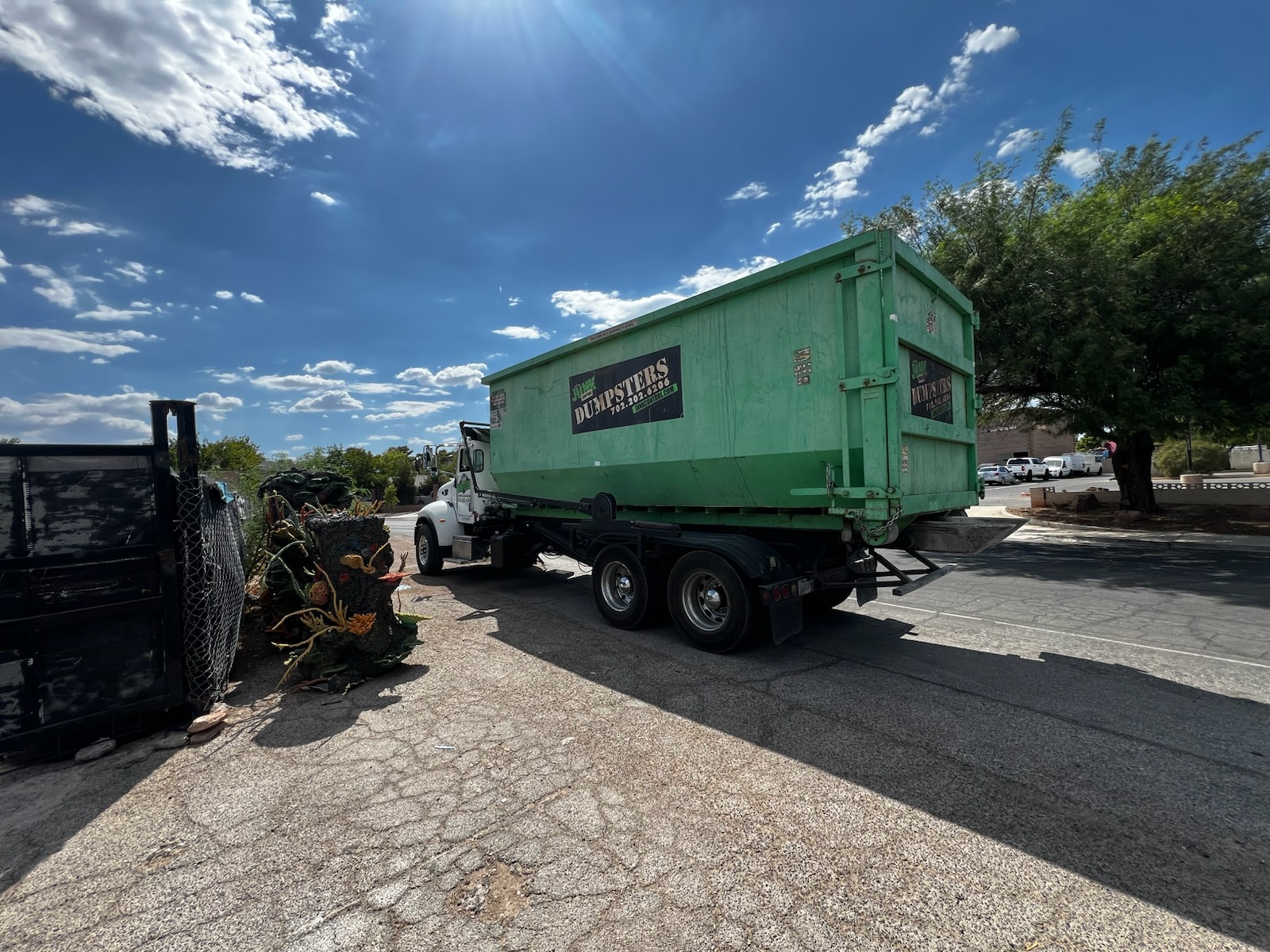 40-yard roll-off dumpster placed in a residential driveway in Summerlin, Las Vegas during a large home renovation and cleanup project.