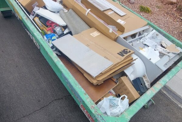 Roll-off dumpster rental in a Summerlin, Las Vegas residential neighborhood during a home renovation project.