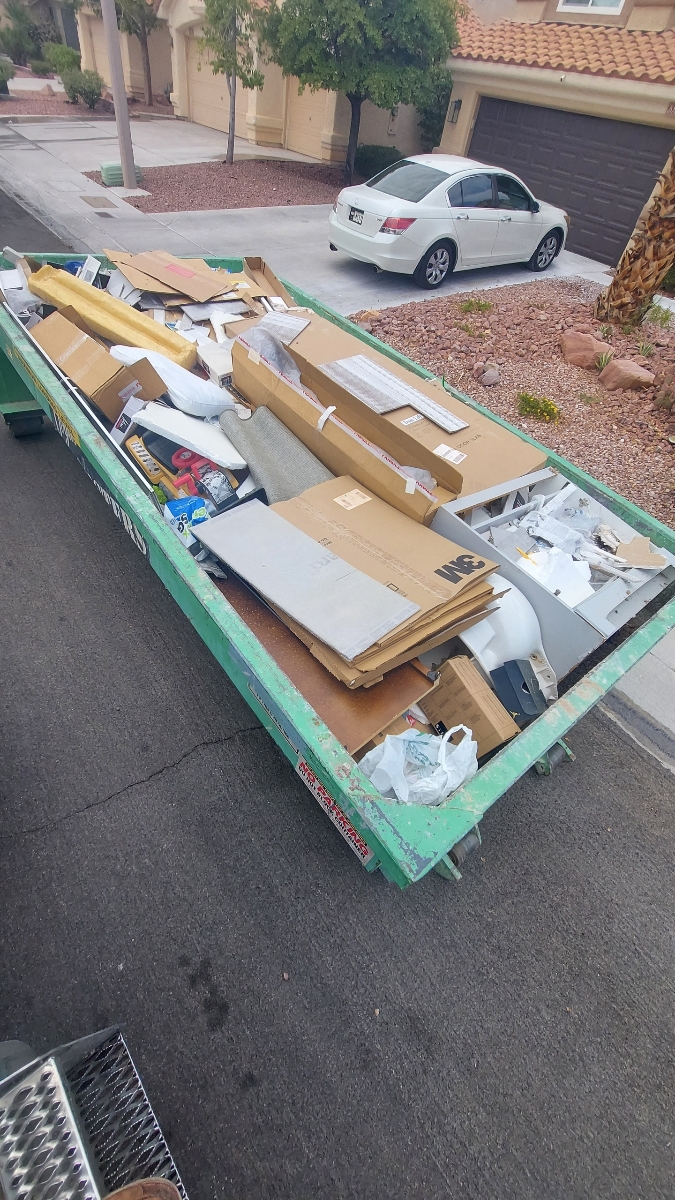 Roll-off dumpster rental in a Summerlin, Las Vegas residential neighborhood during a home renovation project.