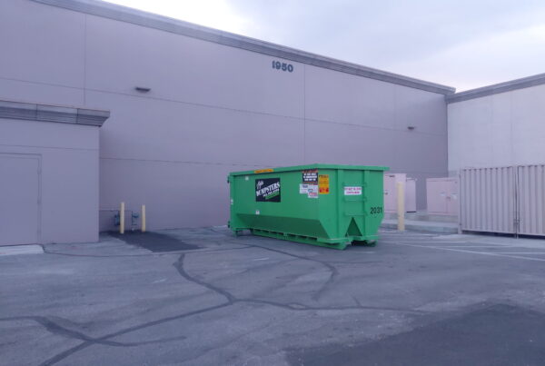20-yard roll-off dumpster rental placed in a residential driveway in Spring Valley, Las Vegas during a home remodeling and cleanup project.