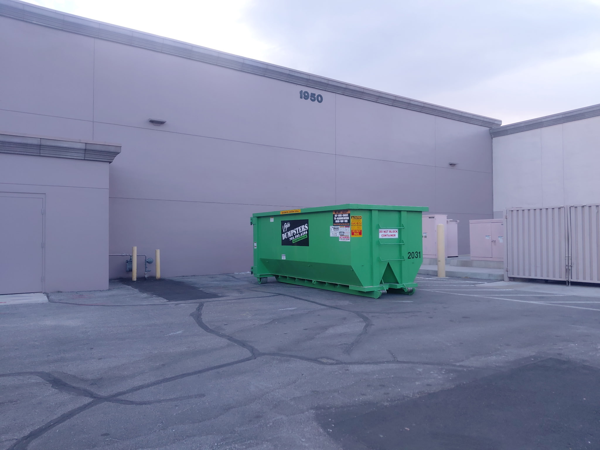 20-yard roll-off dumpster rental placed in a residential driveway in Spring Valley, Las Vegas during a home remodeling and cleanup project.