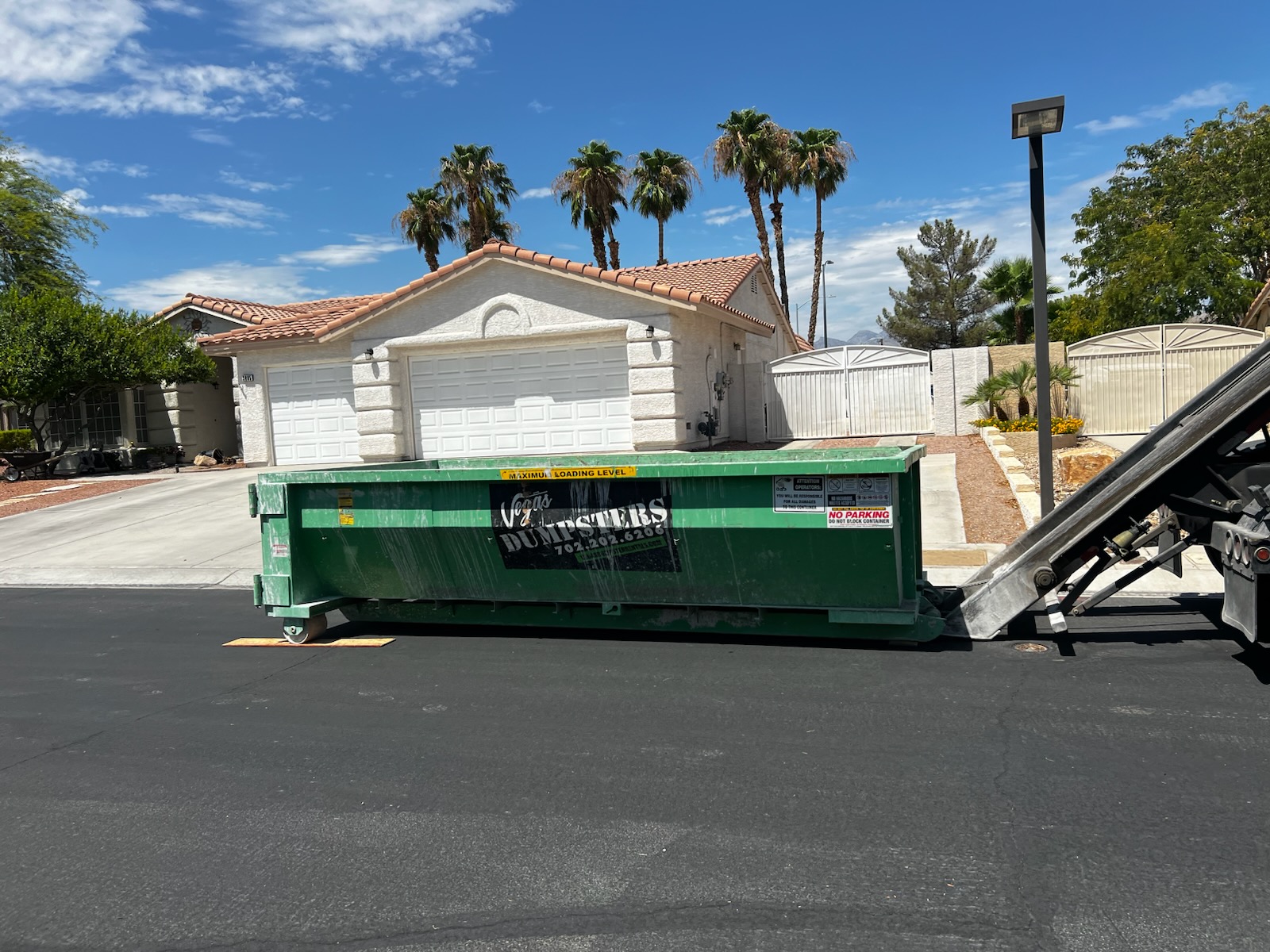 Lowboy dumpster rental in Las Vegas for residential concrete and landscaping renovation